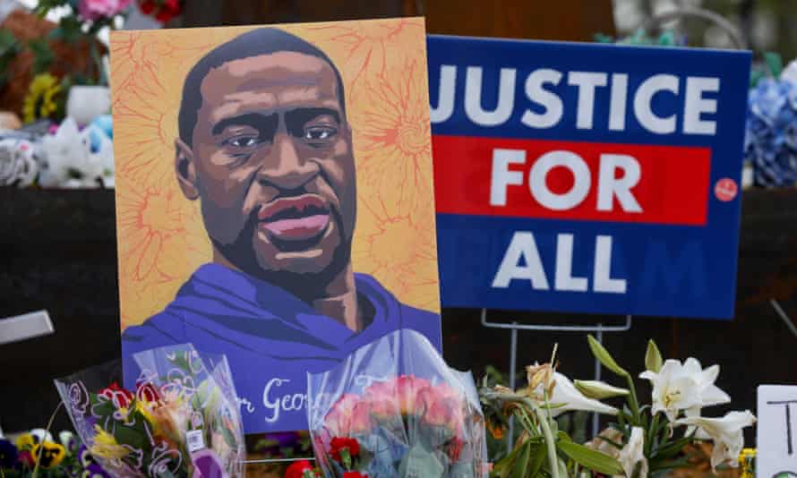 People lay flowers at a memorial in George Floyd Square in Minneapolis, Minnesota, United States on 21 April 2021, after Derek Chauvin was convicted of Floyd’s murder.